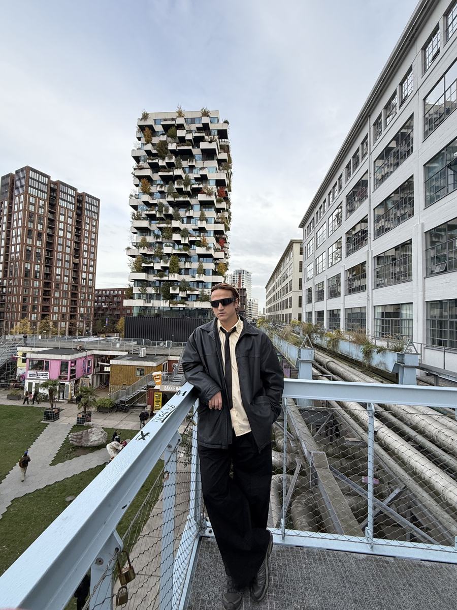 Mahir on the walkway above Strijp-S, with the green Trudo tower behind him
